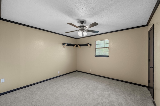 spare room with ceiling fan, a textured ceiling, and ornamental molding