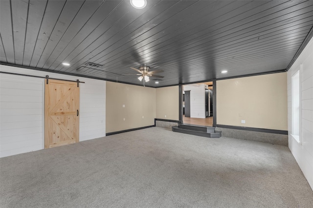 basement with a barn door, wooden ceiling, carpet flooring, and recessed lighting