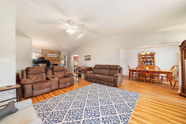 1600 Shaw Dr, Brownwood, TX 76801 - living area featuring light wood-type flooring, lofted ceiling, ceiling fan with notable chandelier, and a brick fireplace