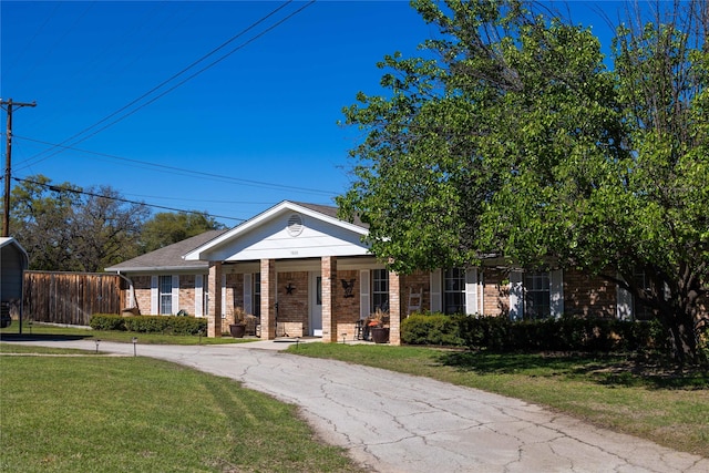 1600 Shaw Dr, Brownwood, TX 76801 - neoclassical home with a porch, brick siding, and a front lawn