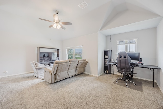 office with plenty of natural light, ceiling fan, carpet, and vaulted ceiling