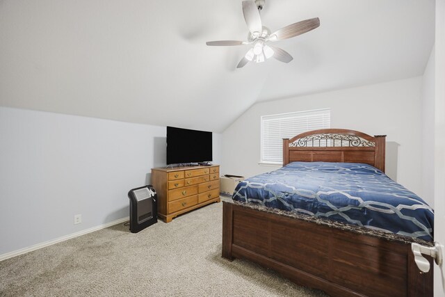 bedroom featuring light colored carpet, ceiling fan, vaulted ceiling, and baseboards