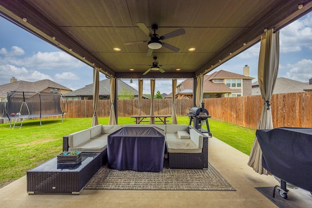 view of patio / terrace featuring outdoor lounge area, a fenced backyard, and a trampoline