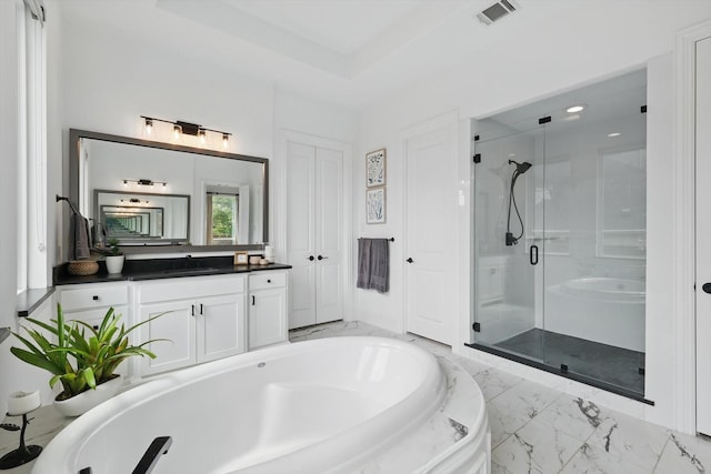full bath with vanity, marble finish floor, visible vents, a bath, and a stall shower