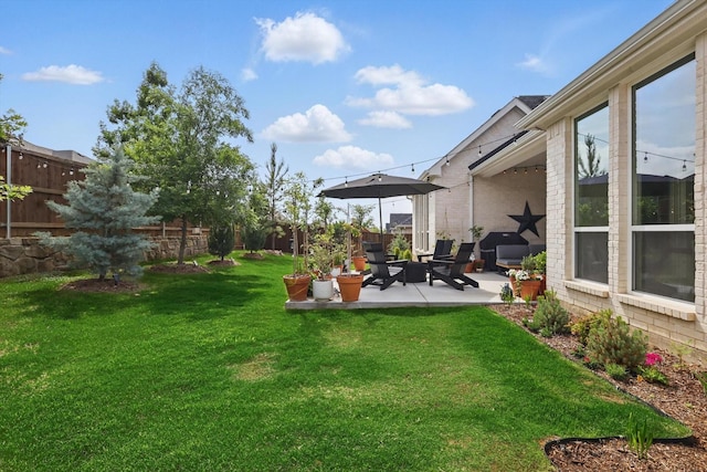 view of yard featuring a fenced backyard and a patio area