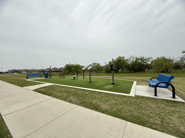 view of property's community with a yard