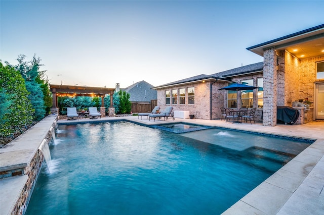 view of swimming pool with fence, outdoor dining space, a patio area, and a pool with connected hot tub