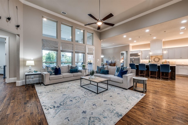 2500 Greenspoint Ln, Prosper, TX 75078 - living room featuring wood finished floors, ornamental molding, ceiling fan, recessed lighting, and baseboards