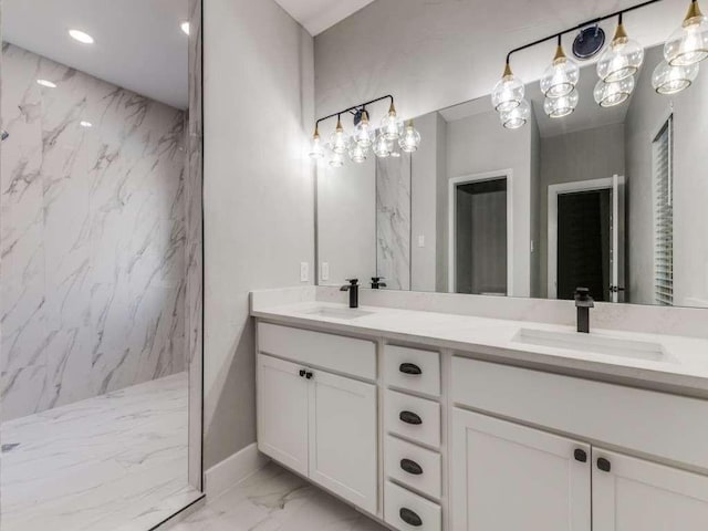 full bath with a marble finish shower, marble finish floor, a sink, and double vanity