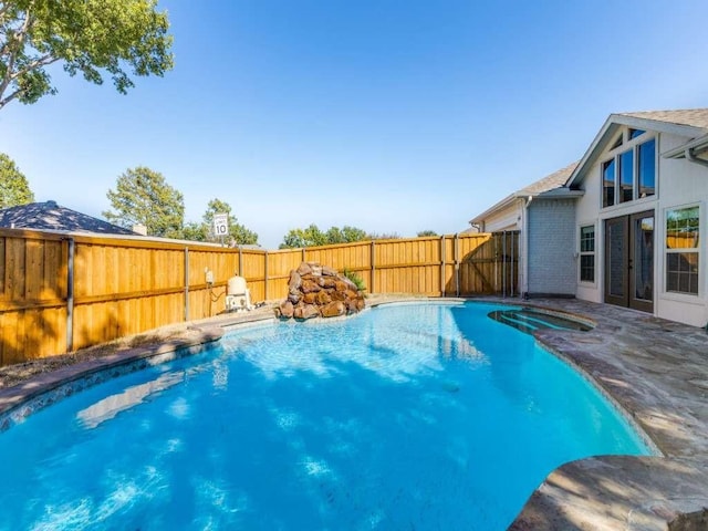 view of swimming pool featuring a fenced backyard, a patio, and a fenced in pool