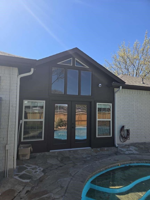 1001 Primrose St, Mesquite, TX 75149 - back of property featuring french doors, brick siding, and a patio