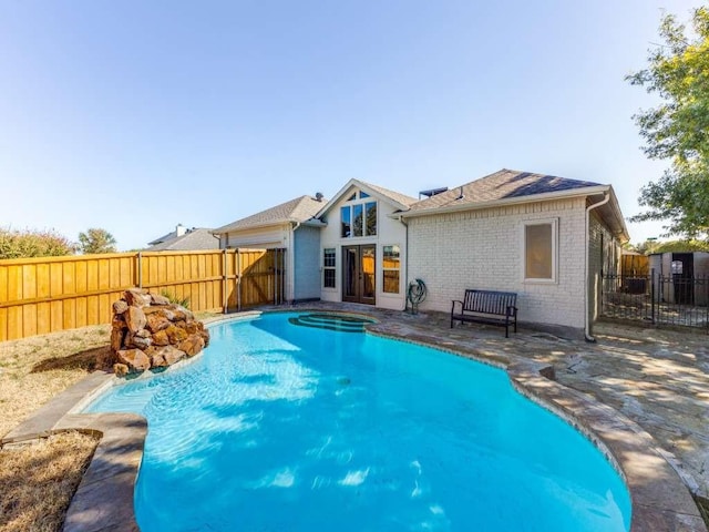 view of pool with a patio area, a fenced backyard, and a fenced in pool