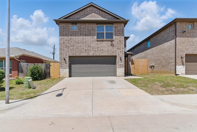 traditional home featuring an attached garage, a gate, fence, brick siding, and driveway