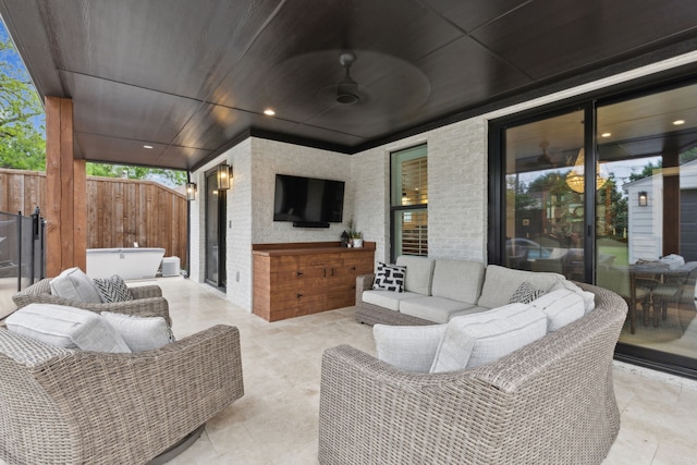 view of patio featuring fence and an outdoor hangout area