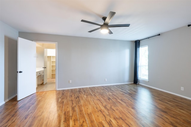 1904 Park Hill Dr, Arlington, TX 76012 - interior space with baseboards, a ceiling fan, and light wood-style floors
