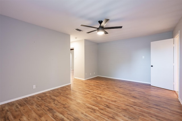 1904 Park Hill Dr, Arlington, TX 76012 - spare room featuring light wood-type flooring, visible vents, baseboards, and ceiling fan