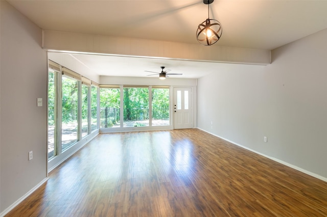 1904 Park Hill Dr, Arlington, TX 76012 - spare room featuring baseboards, wood finished floors, a ceiling fan, and a healthy amount of sunlight