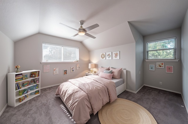carpeted bedroom with a ceiling fan, lofted ceiling, and baseboards