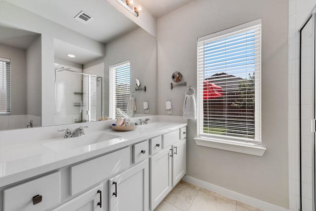 1008 Shire Dr, Aubrey, TX 76227 - full bath featuring a sink, tile patterned flooring, baseboards, and a shower stall