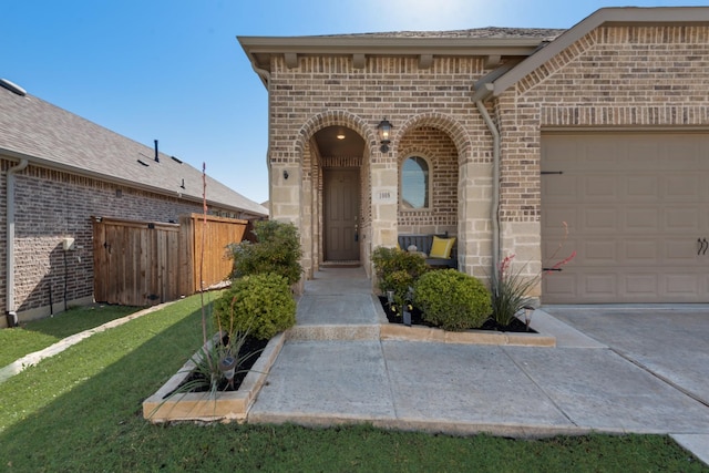 1008 Shire Dr, Aubrey, TX 76227 - property entrance featuring a yard, brick siding, fence, and an attached garage