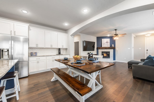 1008 Shire Dr, Aubrey, TX 76227 - kitchen featuring open floor plan, dark wood-type flooring, stainless steel fridge, and tasteful backsplash