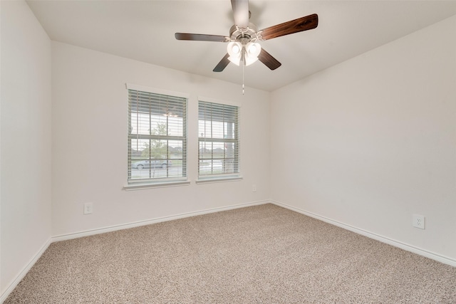 unfurnished room featuring baseboards, ceiling fan, and carpet floors