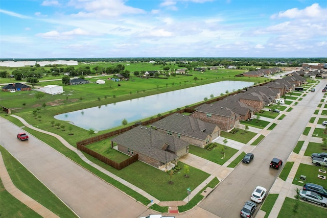 birds eye view of property featuring a residential view and a water view