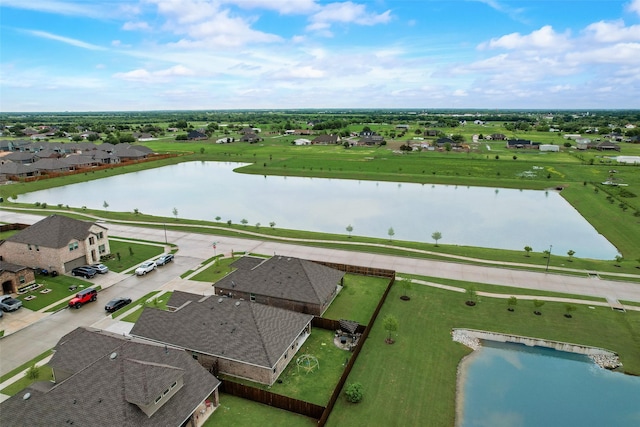 drone / aerial view with a residential view and a water view