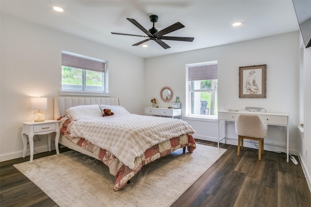 bedroom featuring multiple windows, dark wood finished floors, and recessed lighting