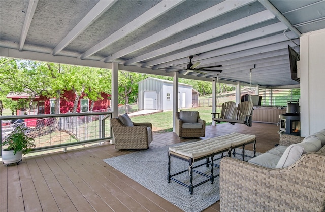 wooden deck featuring an outbuilding