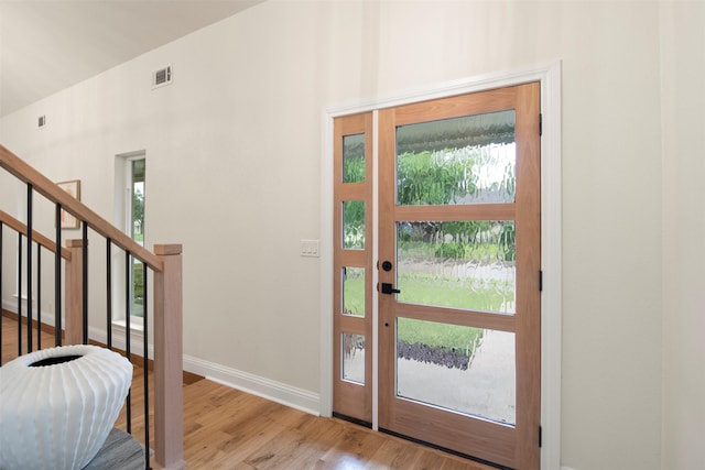 1925 Berkner Dr, Richardson, TX 75081 - entrance foyer featuring baseboards, wood finished floors, and stairs