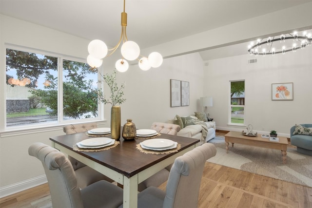 1925 Berkner Dr, Richardson, TX 75081 - dining room with a chandelier, light wood-type flooring, healthy amount of natural light, and vaulted ceiling