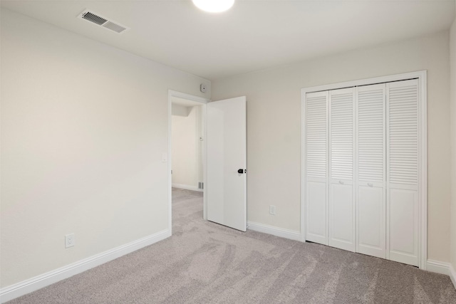 1925 Berkner Dr, Richardson, TX 75081 - unfurnished bedroom featuring light colored carpet, a closet, and baseboards