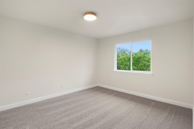 1925 Berkner Dr, Richardson, TX 75081 - carpeted spare room featuring baseboards