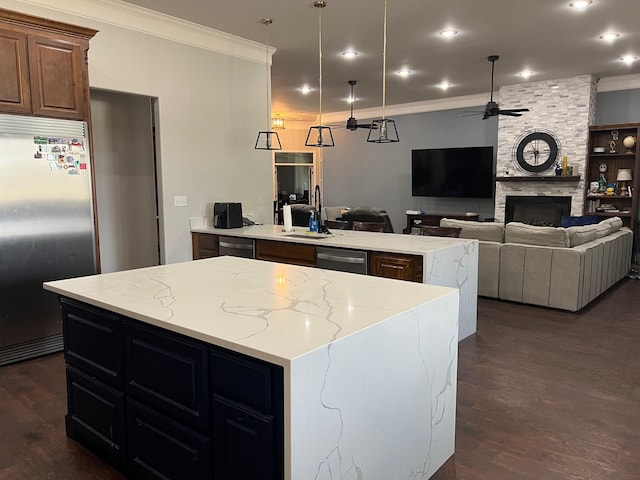251 Rs County Road 3430, Emory, TX 75440 - kitchen featuring a ceiling fan, ornamental molding, stainless steel appliances, and a sink