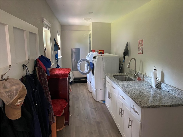 600 Bunny Rabbit Rd N, Athens, TX 75751 - clothes washing area featuring cabinet space, wood finished floors, separate washer and dryer, and a sink