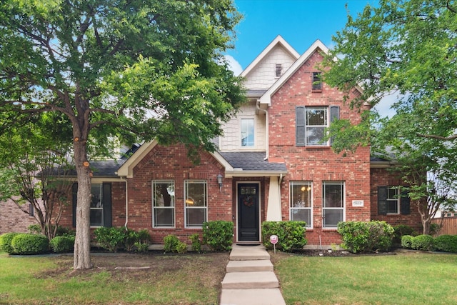 3852 Banner Dr, Frisco, TX 75034 - traditional-style house with a front lawn, roof with shingles, and brick siding
