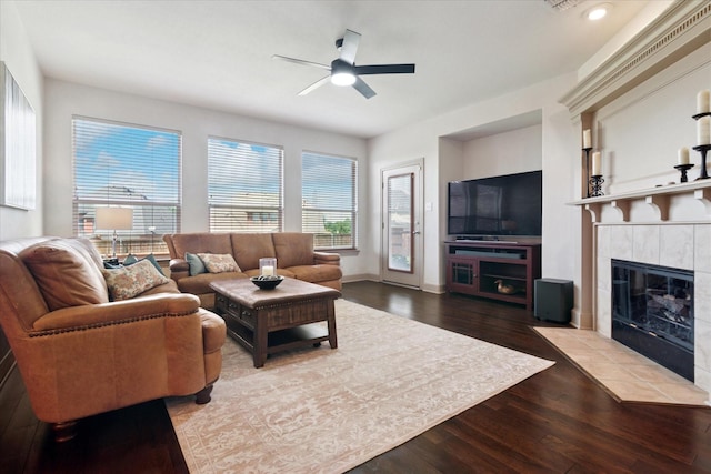 3852 Banner Dr, Frisco, TX 75034 - living area featuring wood finished floors, ceiling fan, and a tiled fireplace