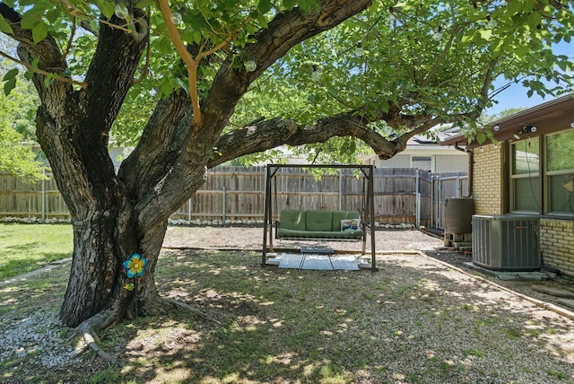 view of yard with a fenced backyard and cooling unit