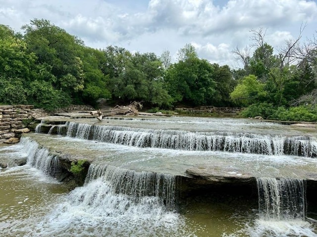 6050 Douglas St, Fort Worth, TX 76114 - surrounding community with a water view and a wooded view