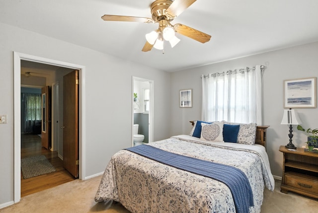 6050 Douglas St, Fort Worth, TX 76114 - bedroom with light carpet, ensuite bath, and a ceiling fan