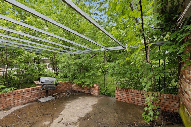 view of patio / terrace featuring a pergola and a grill