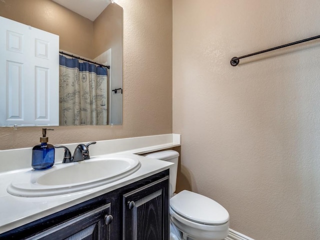 3226 Appleblossom Dr, Frisco, TX 75033 - bathroom with vanity, toilet, a textured wall, and curtained shower
