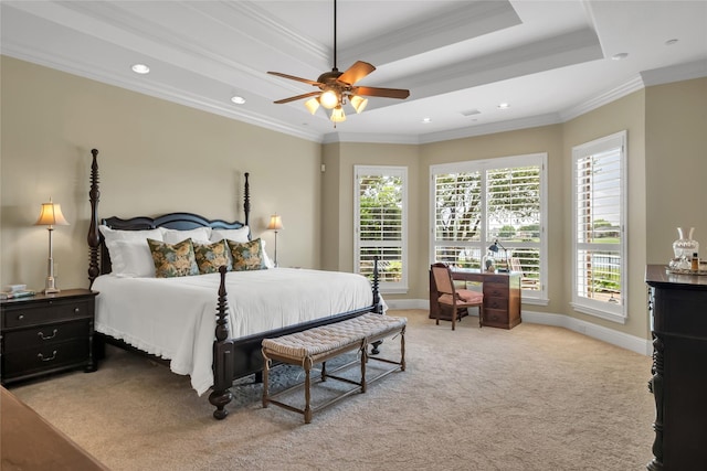 carpeted bedroom featuring ornamental molding, recessed lighting, baseboards, and a tray ceiling