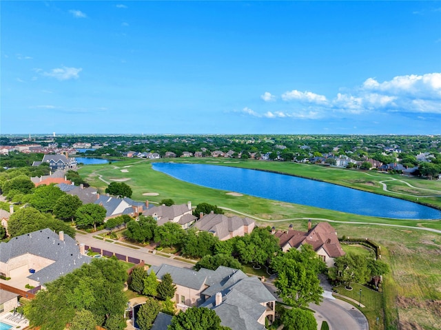 aerial view featuring golf course view, a residential view, and a water view