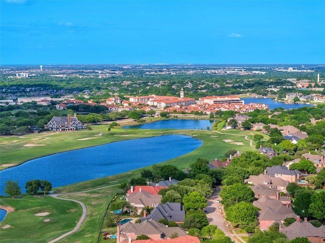 birds eye view of property with a residential view, golf course view, and a water view