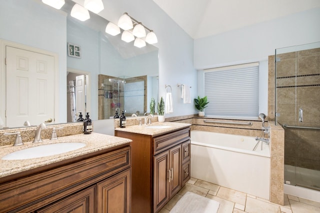 full bath featuring a garden tub, a sink, and a stall shower