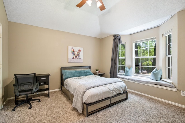 carpeted bedroom featuring baseboards and ceiling fan