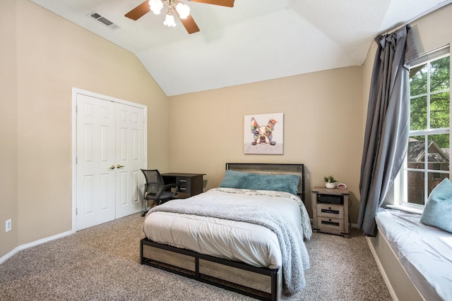 bedroom featuring vaulted ceiling, visible vents, carpet flooring, and baseboards