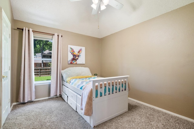bedroom with carpet flooring, baseboards, and ceiling fan
